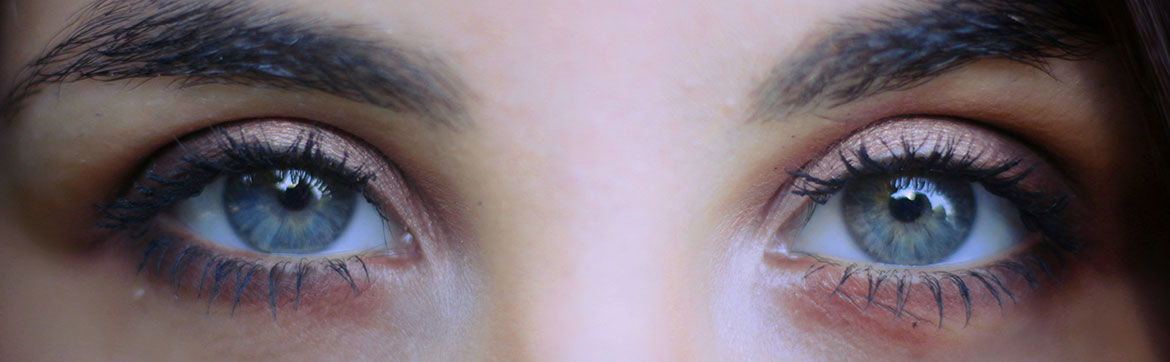 A close up photograph of two human eyes